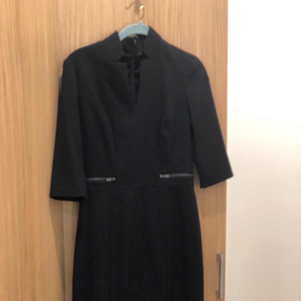 Form fitting black dress.